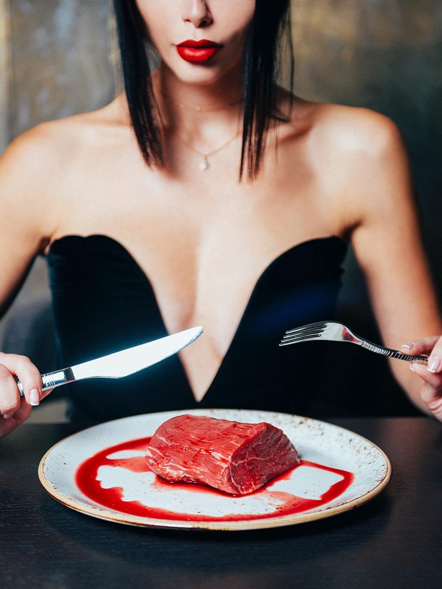 woman eat raw steak